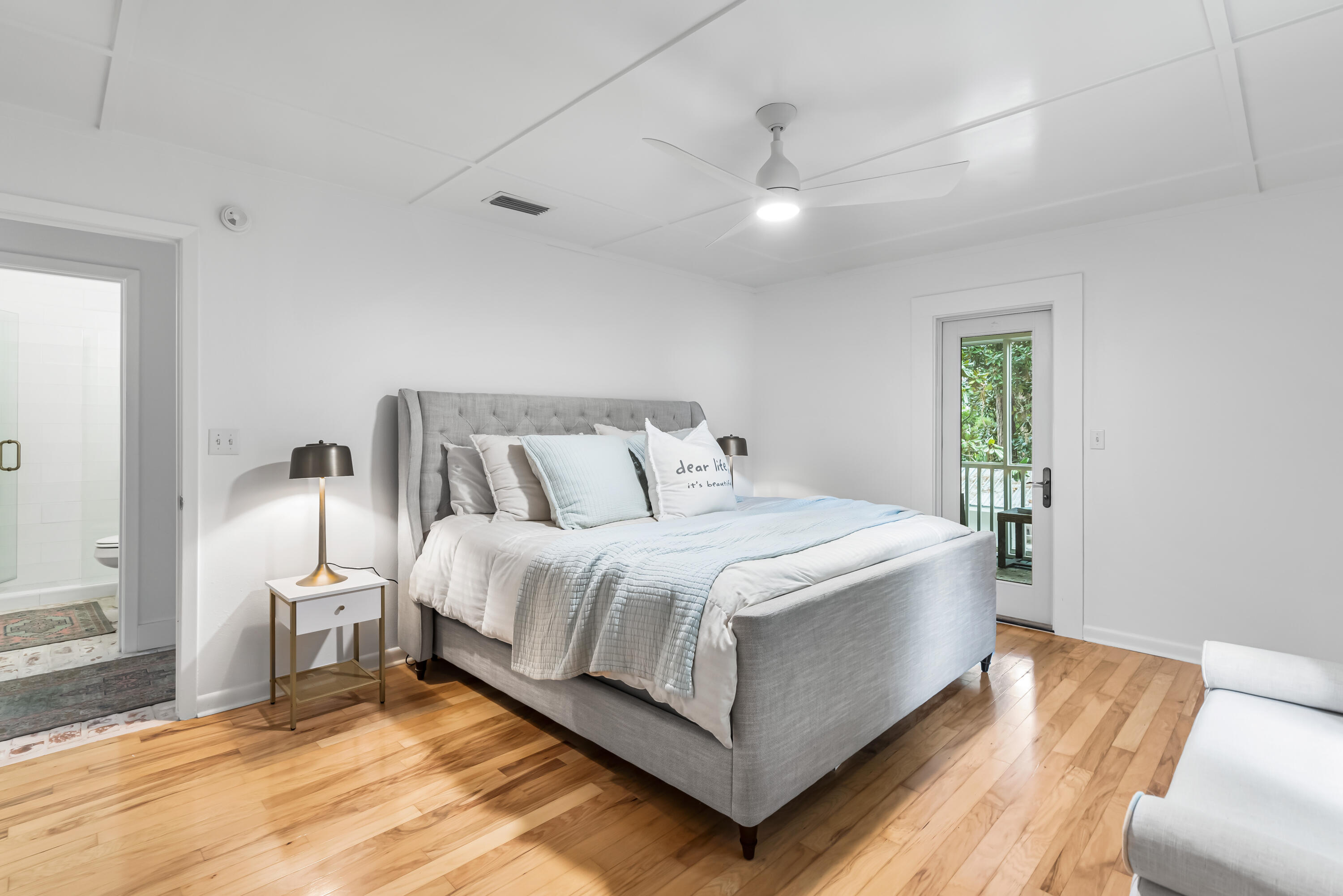 345 Defuniak Street Santa Rosa Beach, FL 32459 - Photo 26 of 52 a spacious bedroom with a bed and a couch