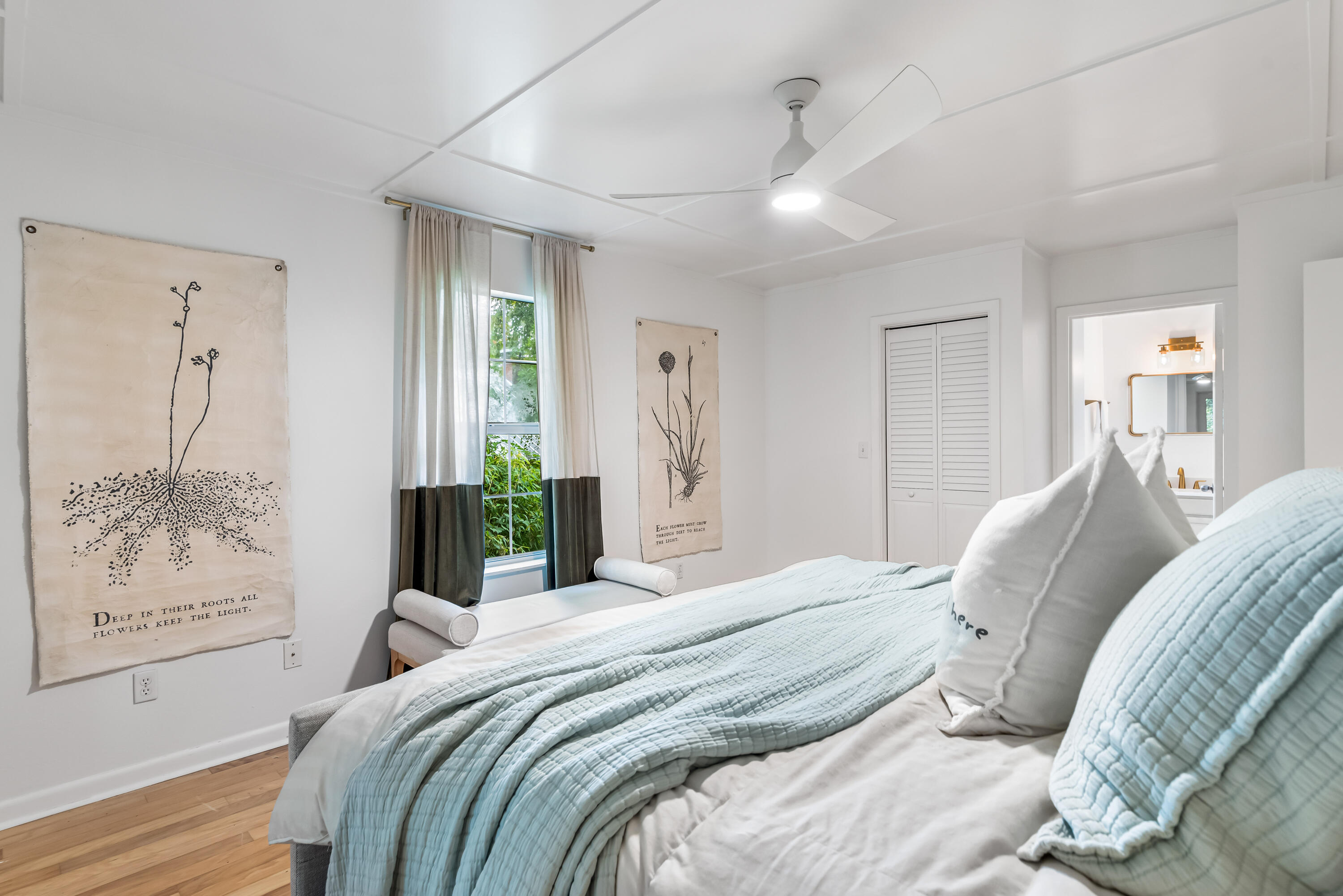 345 Defuniak Street Santa Rosa Beach, FL 32459 - Photo 27 of 52 a bedroom with a large bed and a chandelier