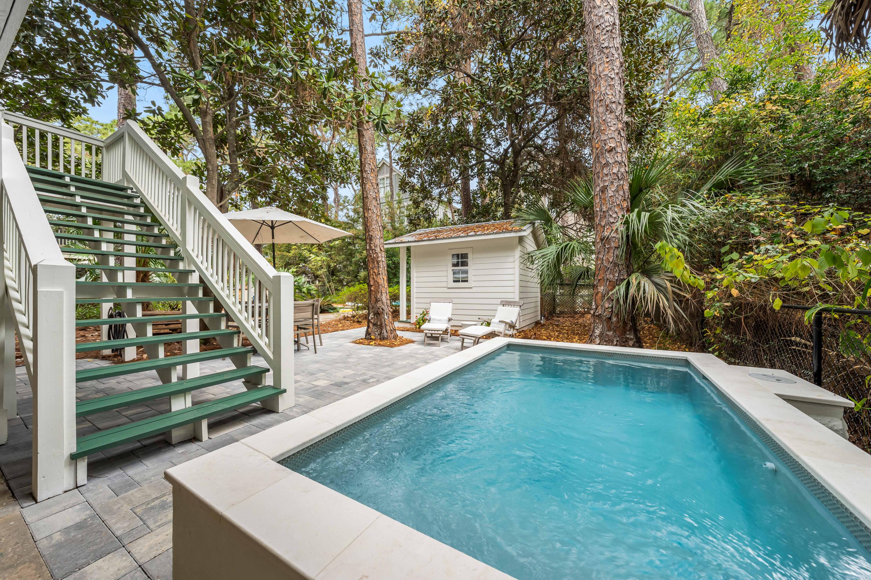 345 Defuniak Street Santa Rosa Beach, FL 32459 - Photo 42 of 52 a view of a patio with swimming pool