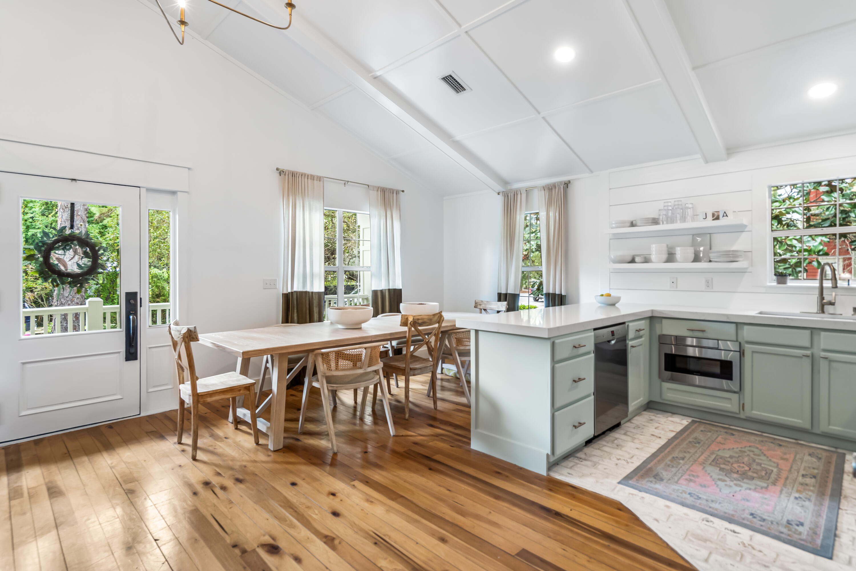 345 Defuniak Street Santa Rosa Beach, FL 32459 - Photo 8 of 52 a kitchen with a table and chairs in it