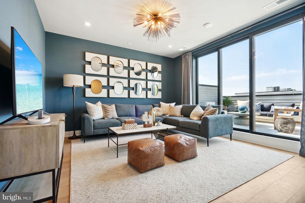 2015 Tysons Ridgeline Road Falls Church, VA 22043 - Photo 13 of 18 a living room with furniture and a flat screen tv