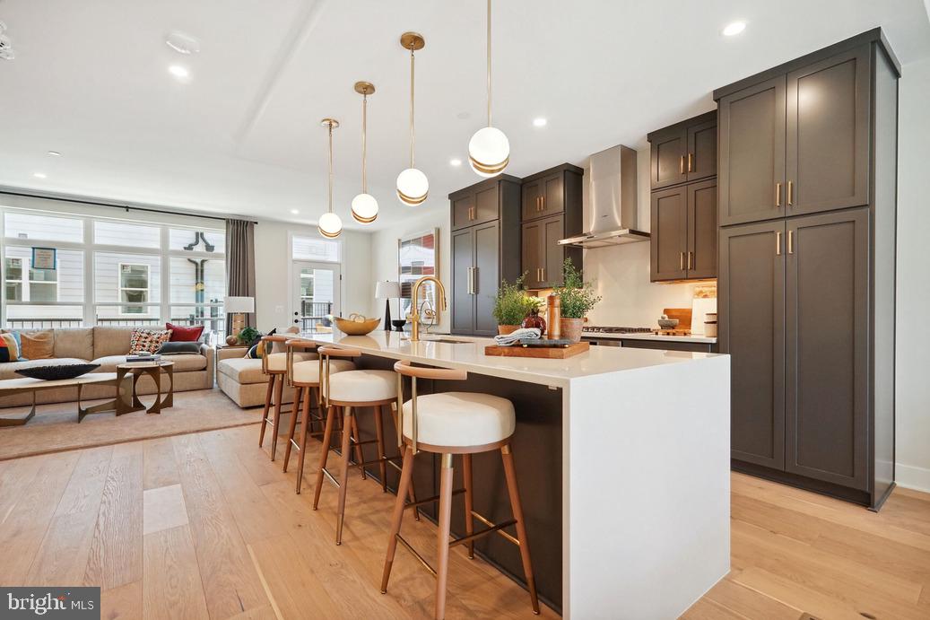 2015 Tysons Ridgeline Road Falls Church, VA 22043 - Photo 6 of 18 a large kitchen with a table and chairs