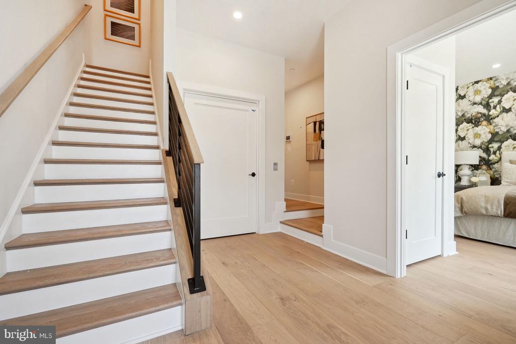 2015 Tysons Ridgeline Road Falls Church, VA 22043 - Photo 9 of 18 a view of a livingroom with wooden floor and stairs