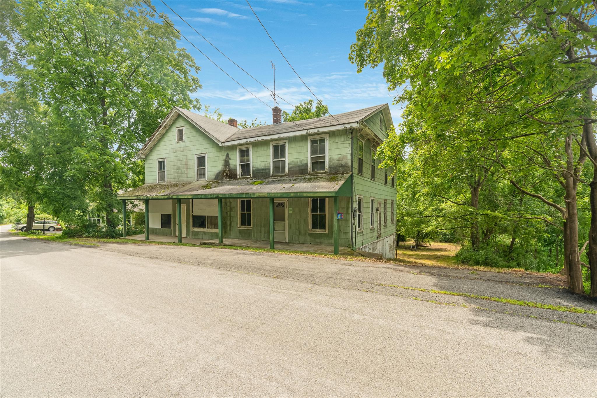 50 Maple Street Catskill, NY 12414 - Photo 2 of 27 a front view of a house with a garden
