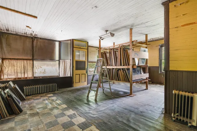 a view of a room with wooden walls