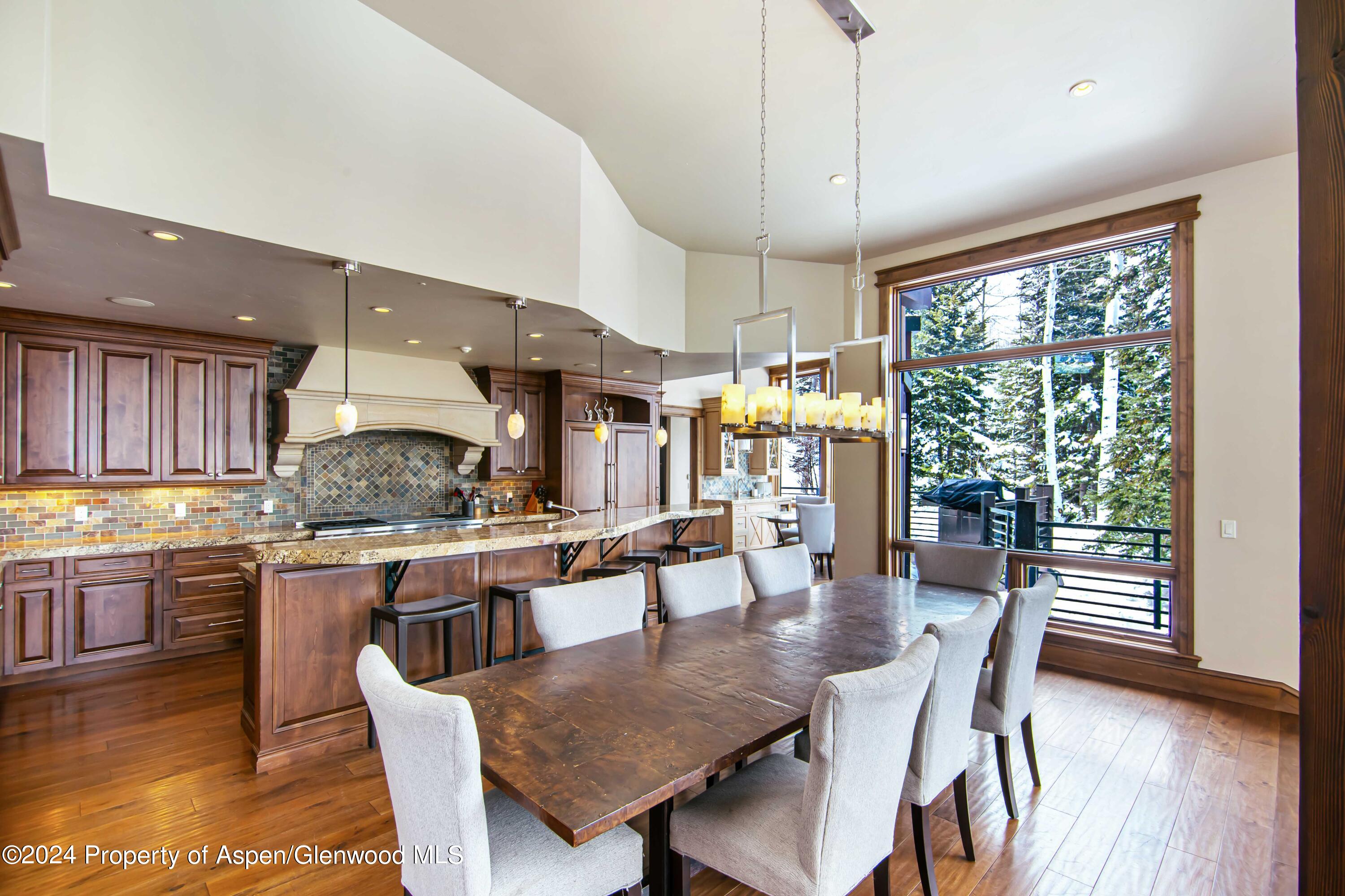 1457 Wood Road Snowmass Village, CO 81615 - Photo 19 of 70 a kitchen with lots of counter top space and wooden floor