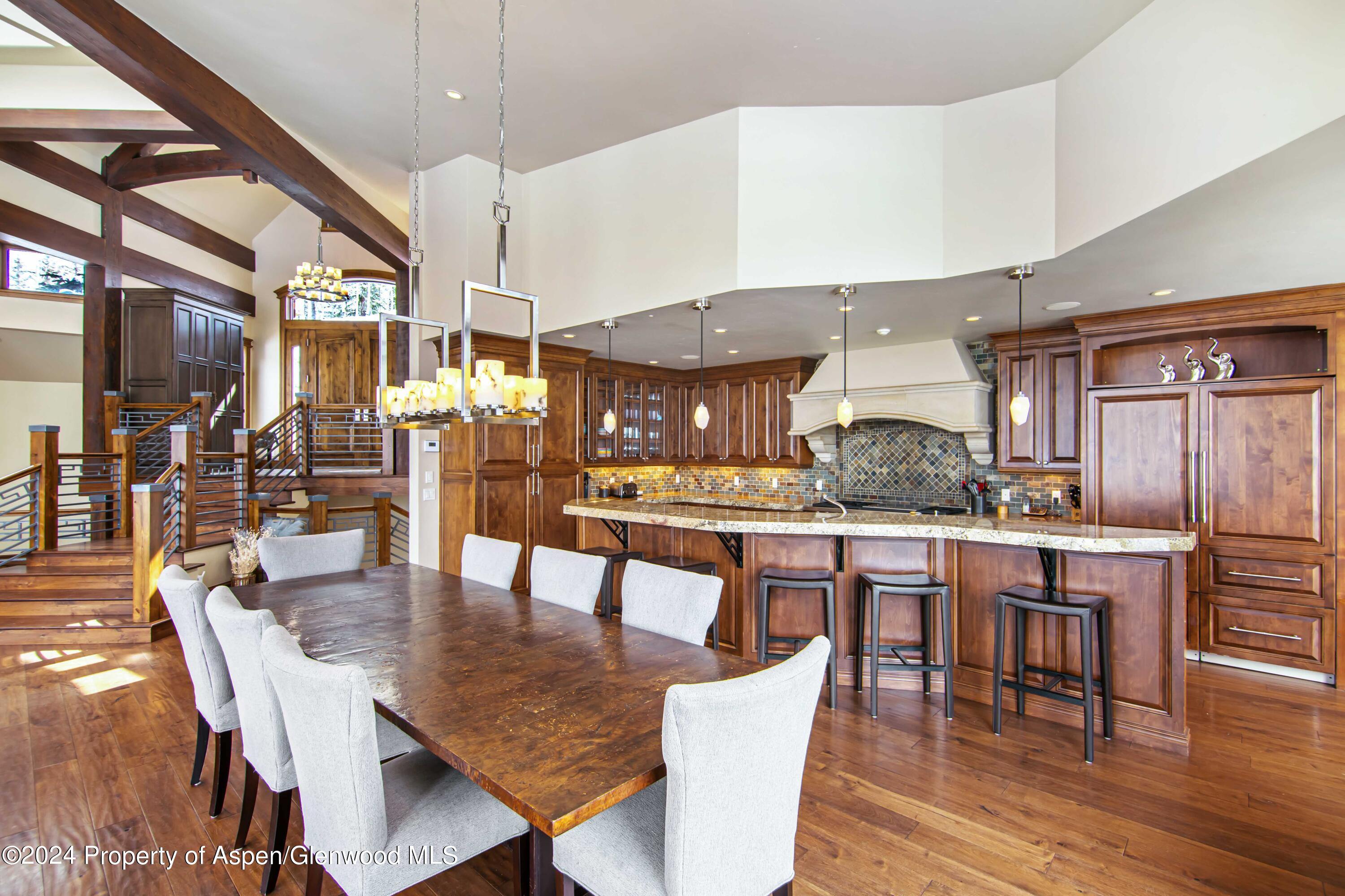 1457 Wood Road Snowmass Village, CO 81615 - Photo 20 of 70 a dining area with a table and chairs