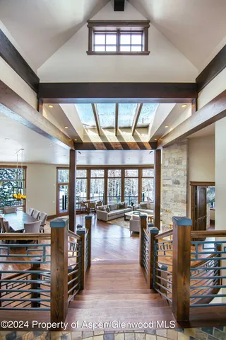 a bathroom with a tub a sink and mirrors