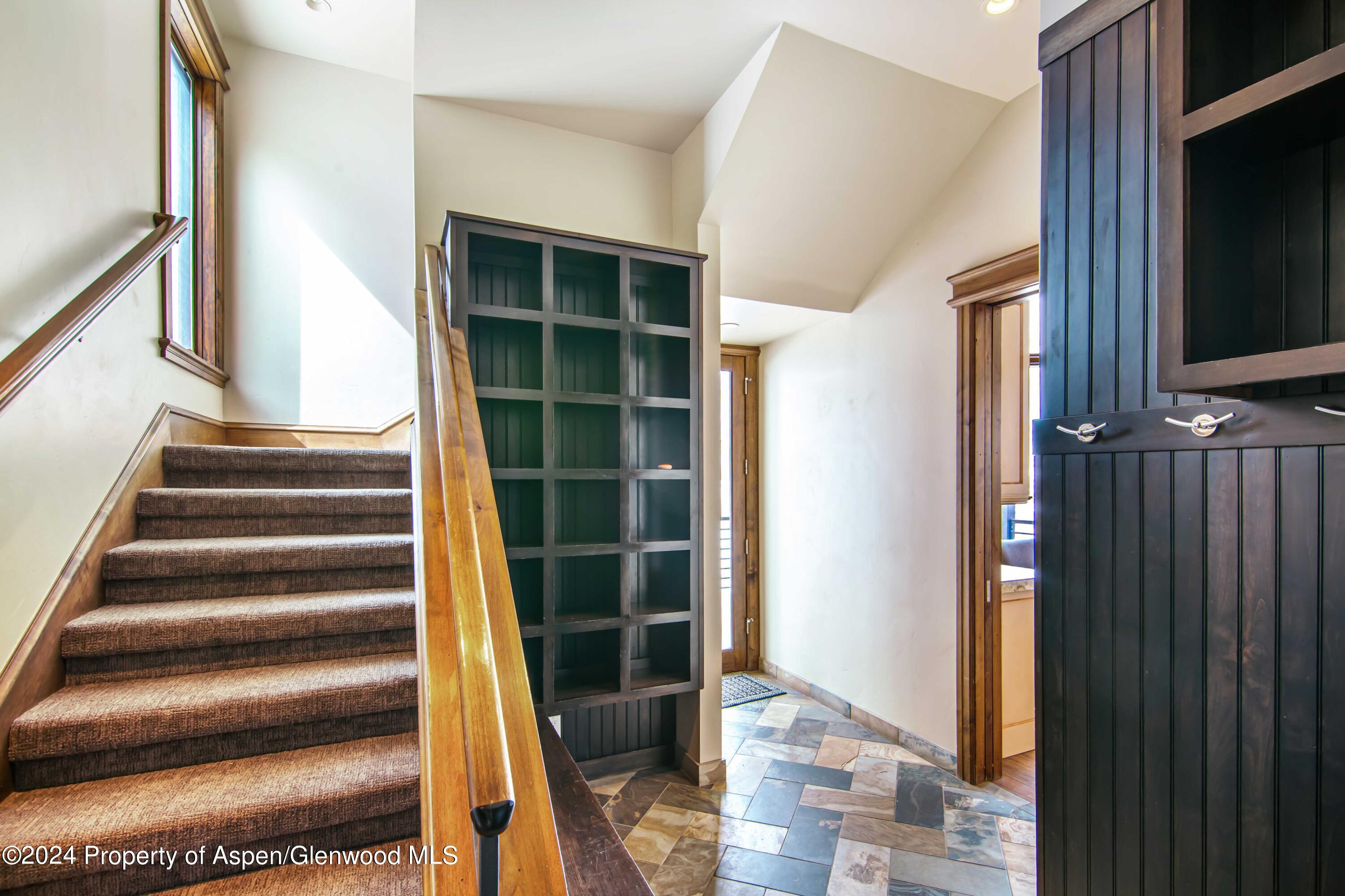 1457 Wood Road Snowmass Village, CO 81615 - Photo 24 of 70 a view of staircase with white walls and a window