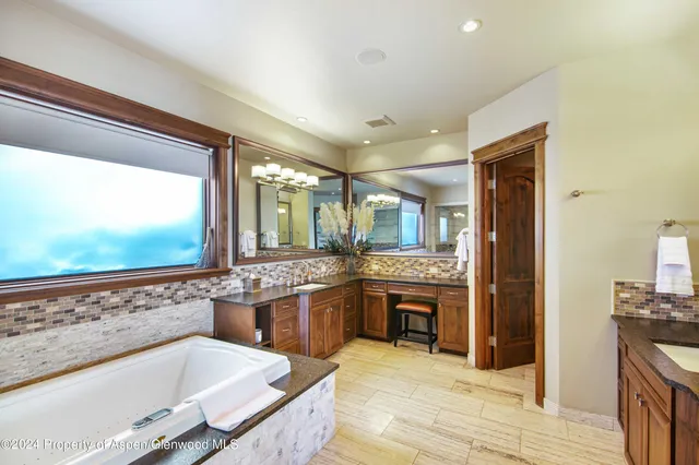 a bed sitting in a room next to a window