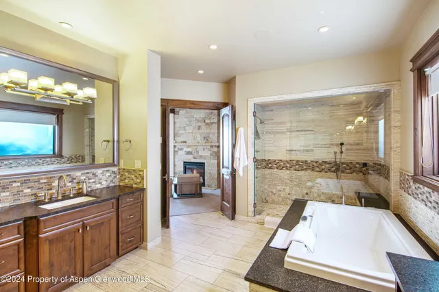 a bedroom with a bed and a mirror