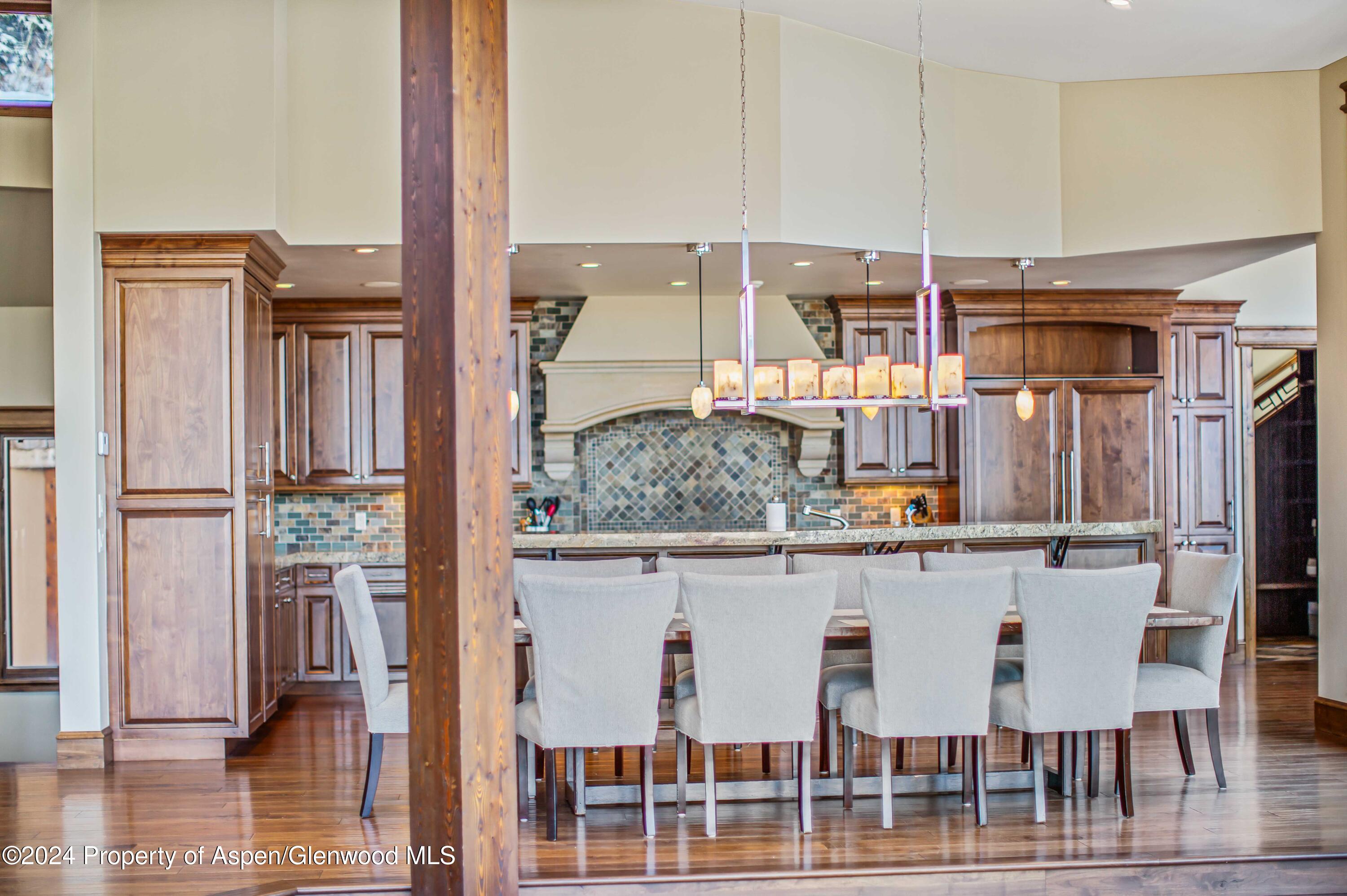 1457 Wood Road Snowmass Village, CO 81615 - Photo 59 of 70 a kitchen with a refrigerator and countertop