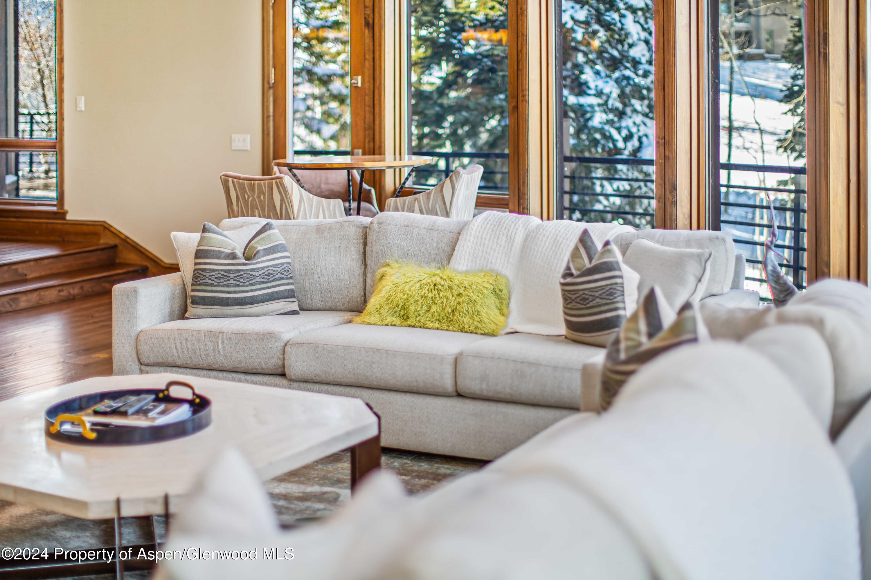 1457 Wood Road Snowmass Village, CO 81615 - Photo 6 of 70 a living room with furniture and a large window