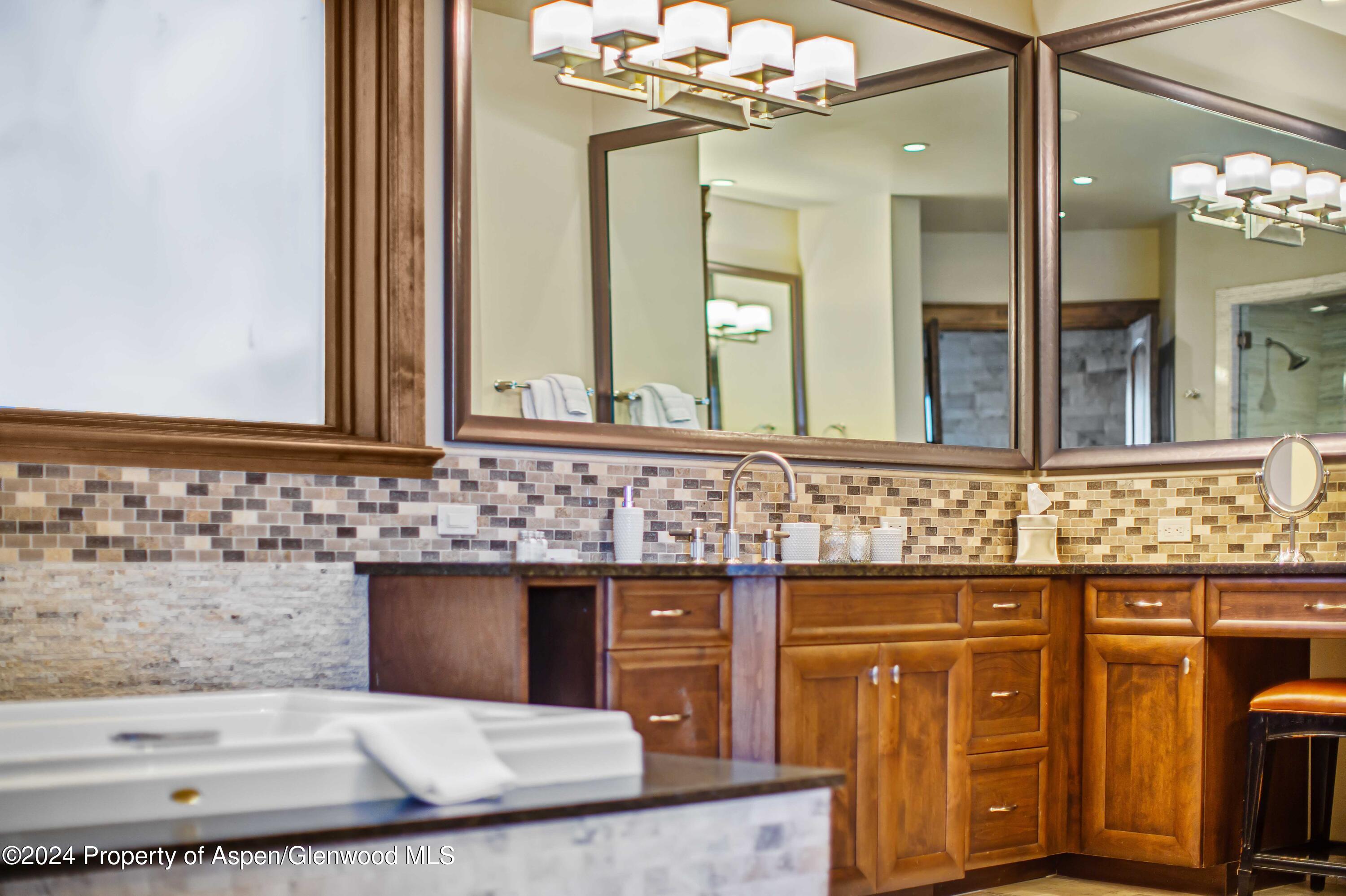 1457 Wood Road Snowmass Village, CO 81615 - Photo 68 of 70 a bathroom with a sink and a mirror