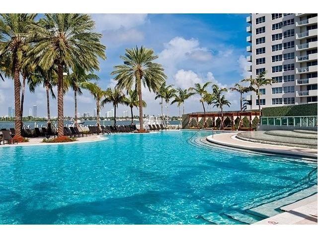 1500 Bay Road, Unit 644S Miami Beach, FL 33139 - Photo 1 of 24 a view of a swimming pool with a garden