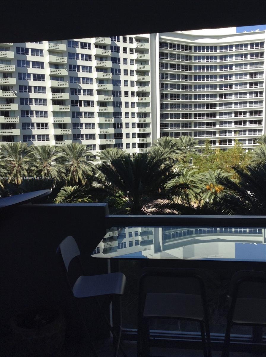 1500 Bay Road, Unit 644S Miami Beach, FL 33139 - Photo 11 of 24 a view of a balcony with chairs and table