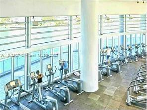 1500 Bay Road, Unit 644S Miami Beach, FL 33139 - Photo 23 of 24 a view of a living room with furniture and floor to ceiling windows