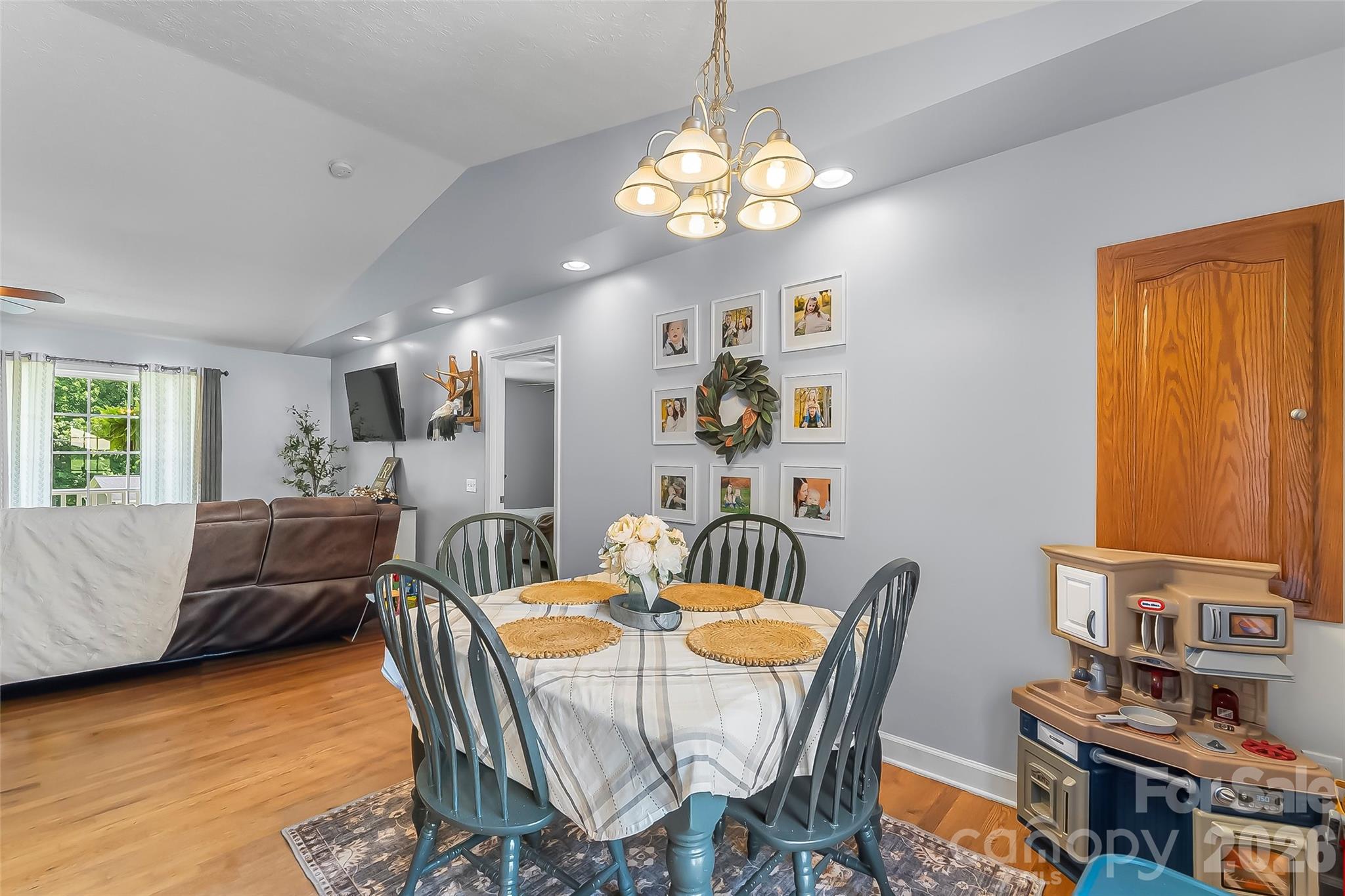 1498 Salem Road Morganton, NC 28655 - Photo 13 of 32 a view of a dining room with furniture and a chandelier