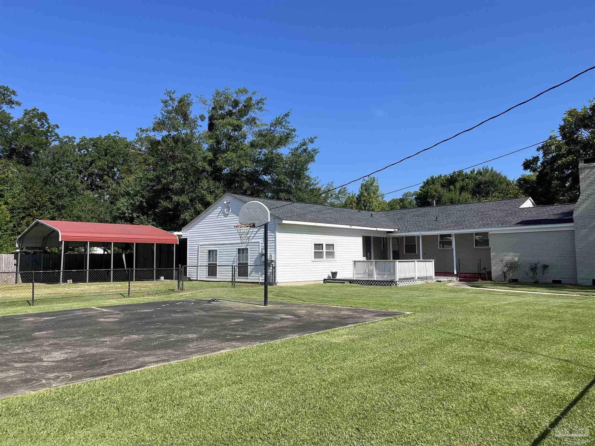 326 East Horner Street Atmore, AL 36502 - Photo 20 of 26 a front view of house with yard and green space