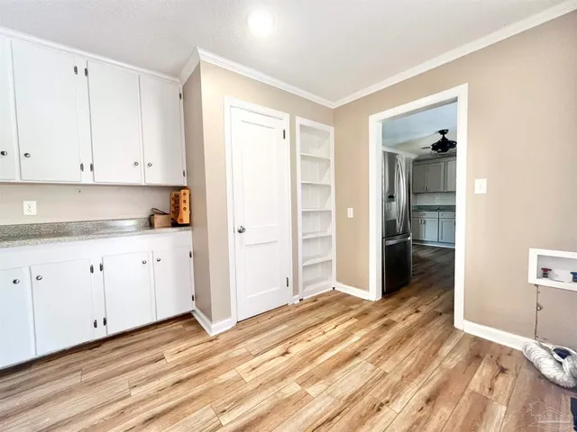 a view of a kitchen with wooden floor