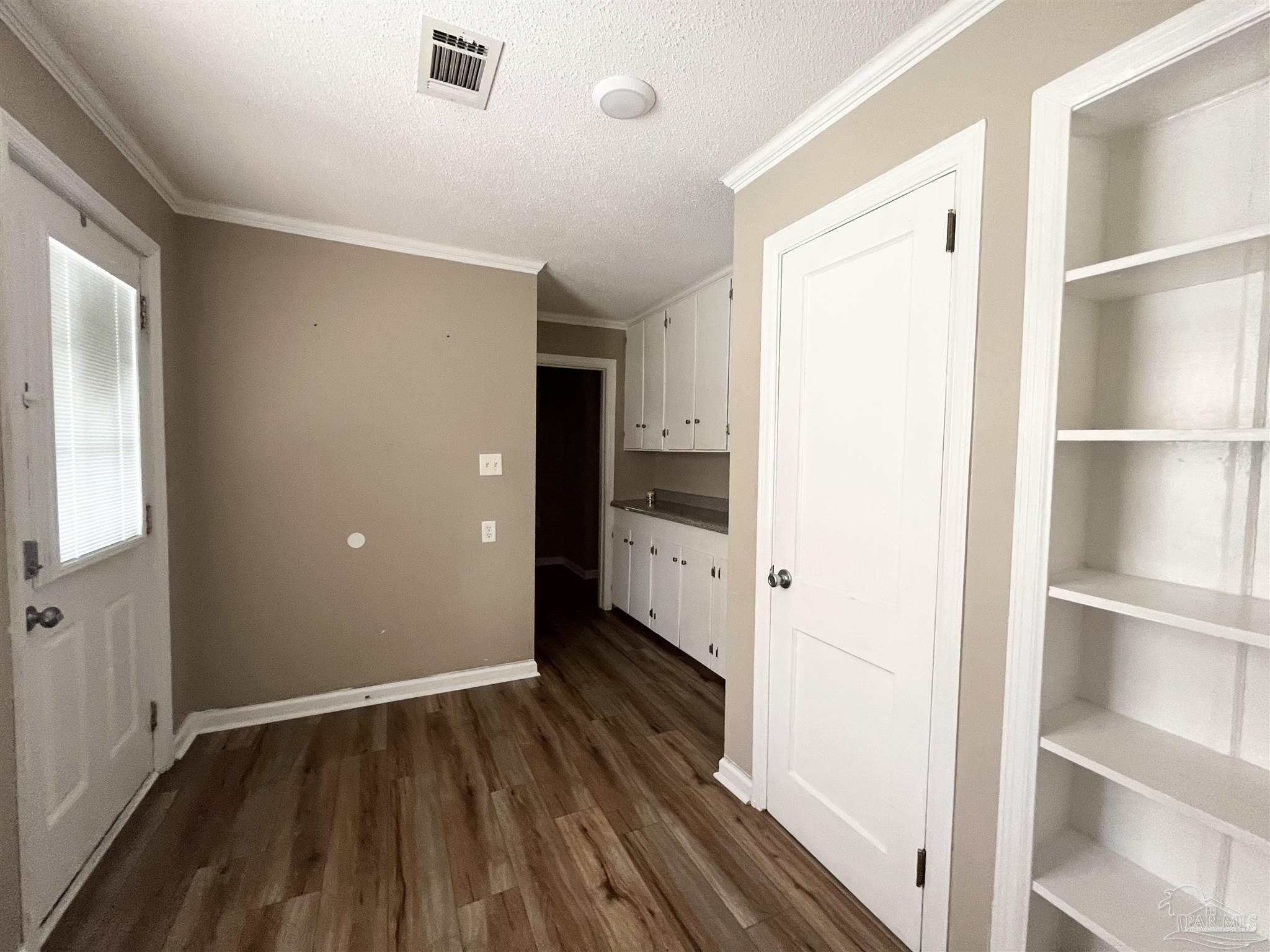 326 East Horner Street Atmore, AL 36502 - Photo 10 of 26 a view of wooden floor in an empty room