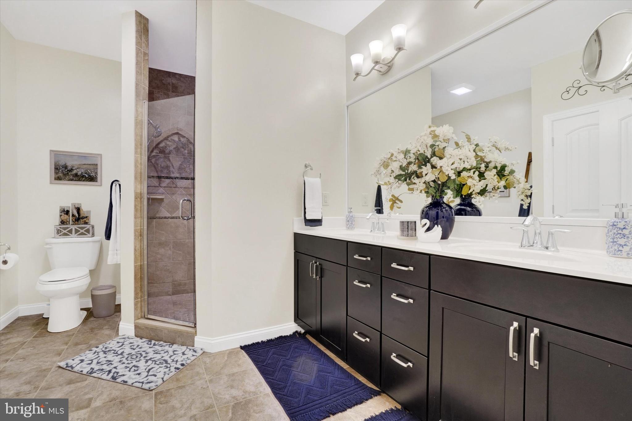 558 Rocky Road Red Lion, PA 17356 - Photo 19 of 45 a spacious bathroom with a sink a toilet and a mirror