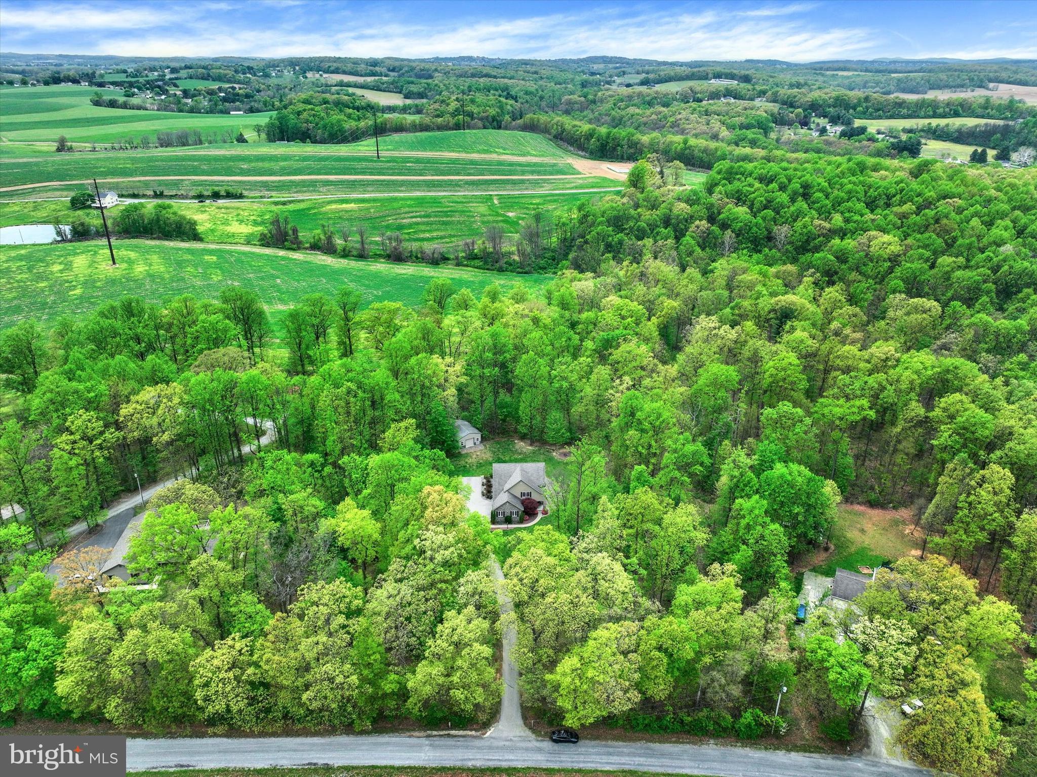 558 Rocky Road Red Lion, PA 17356 - Photo 2 of 45 a view of a lush green field with lots of bushes