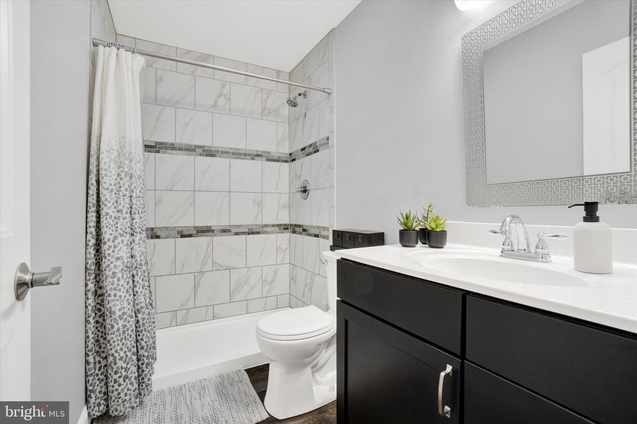 558 Rocky Road Red Lion, PA 17356 - Photo 26 of 45 a bathroom with a sink toilet a mirror and shower