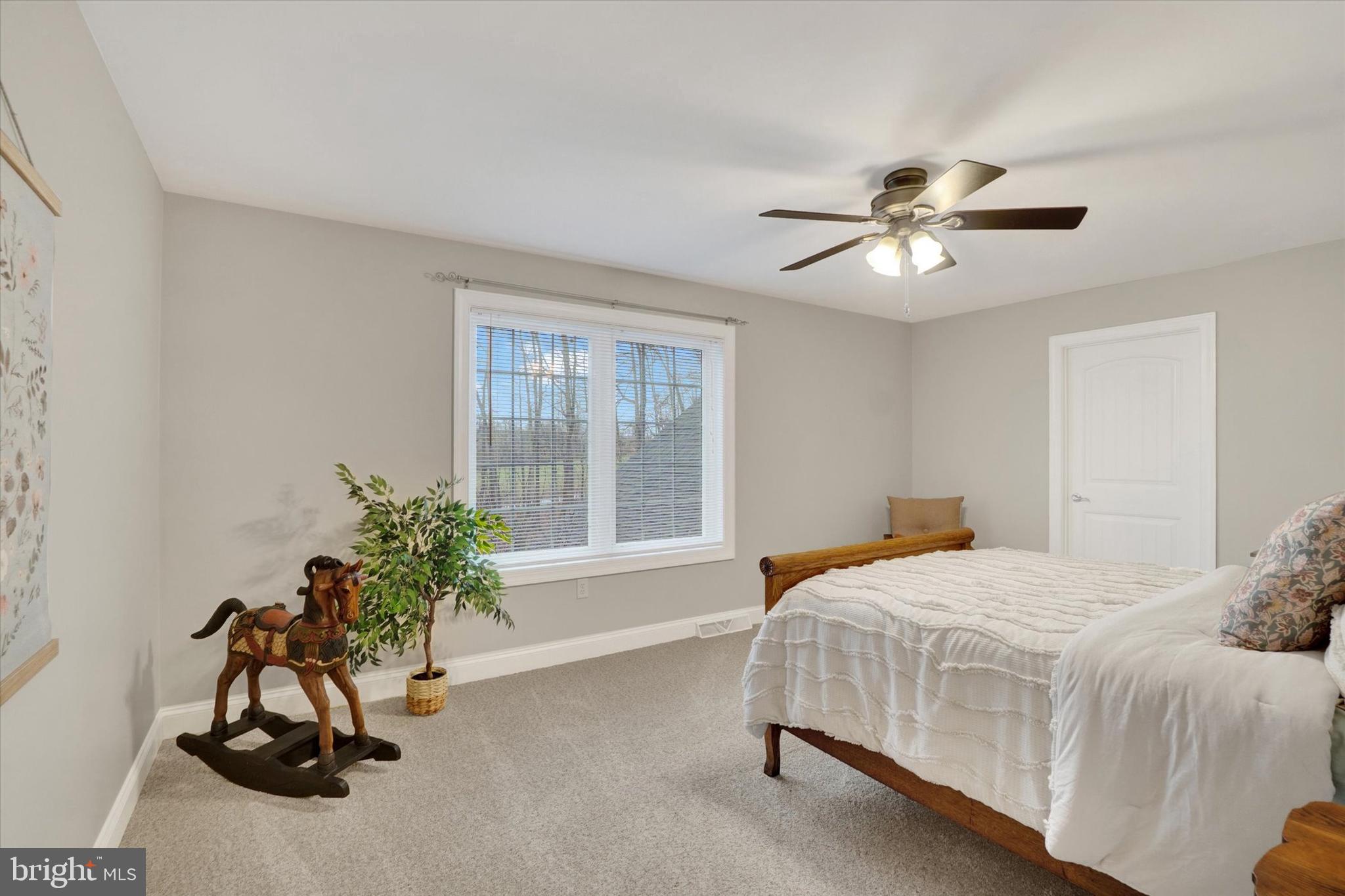558 Rocky Road Red Lion, PA 17356 - Photo 30 of 45 a bedroom with a bed and a potted plant