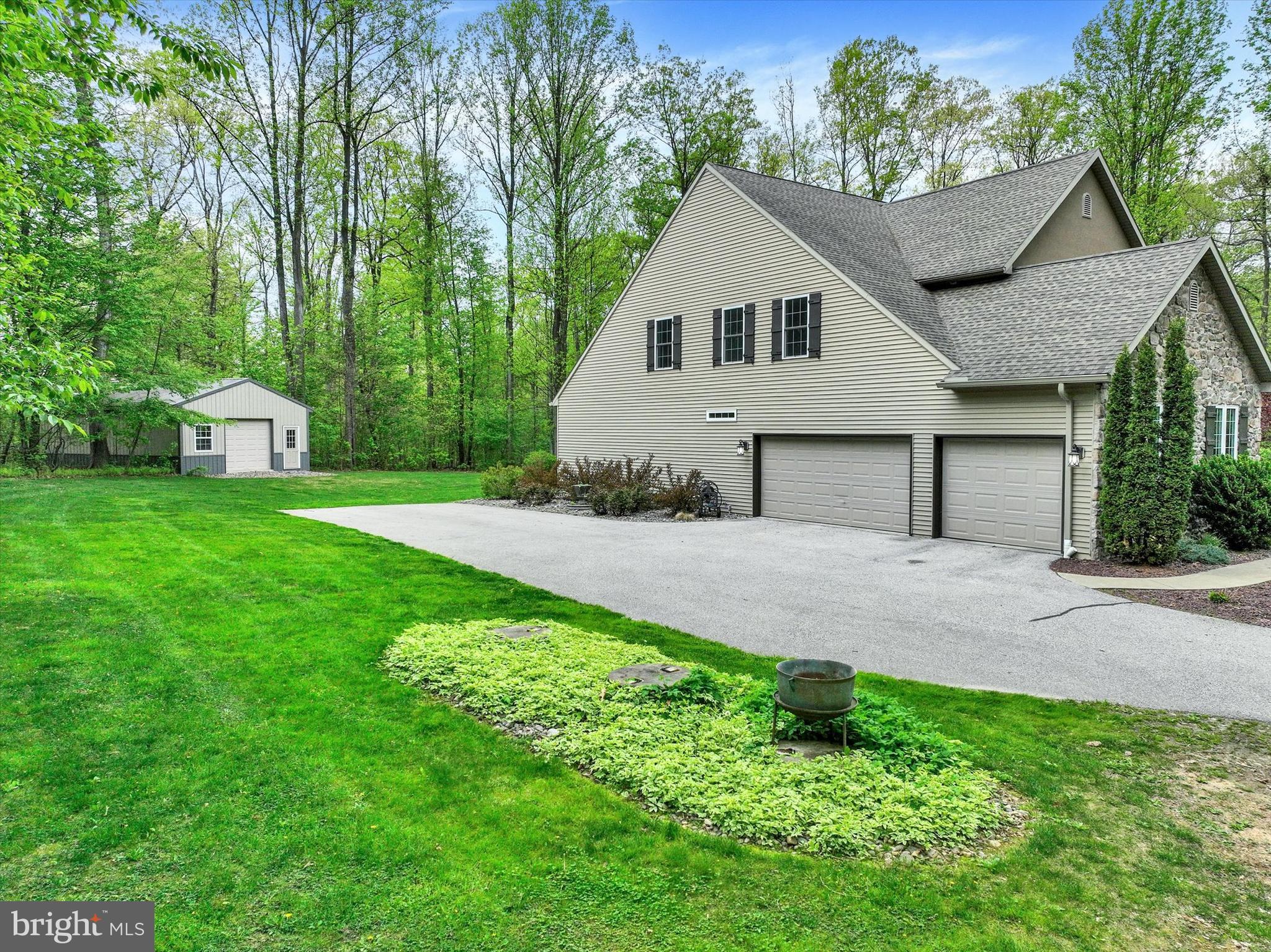 558 Rocky Road Red Lion, PA 17356 - Photo 5 of 45 a house that is sitting in the grass with tress in the background