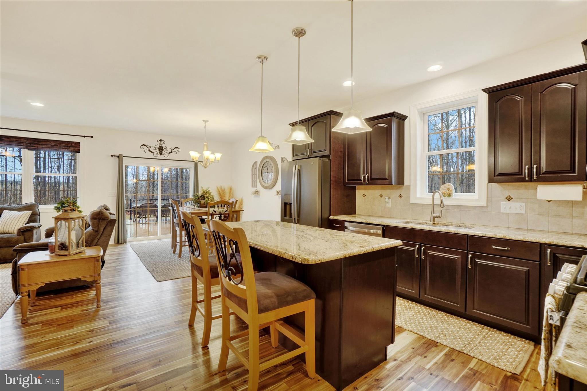 558 Rocky Road Red Lion, PA 17356 - Photo 10 of 45 a kitchen with stainless steel appliances granite countertop a kitchen island a stove and a sink