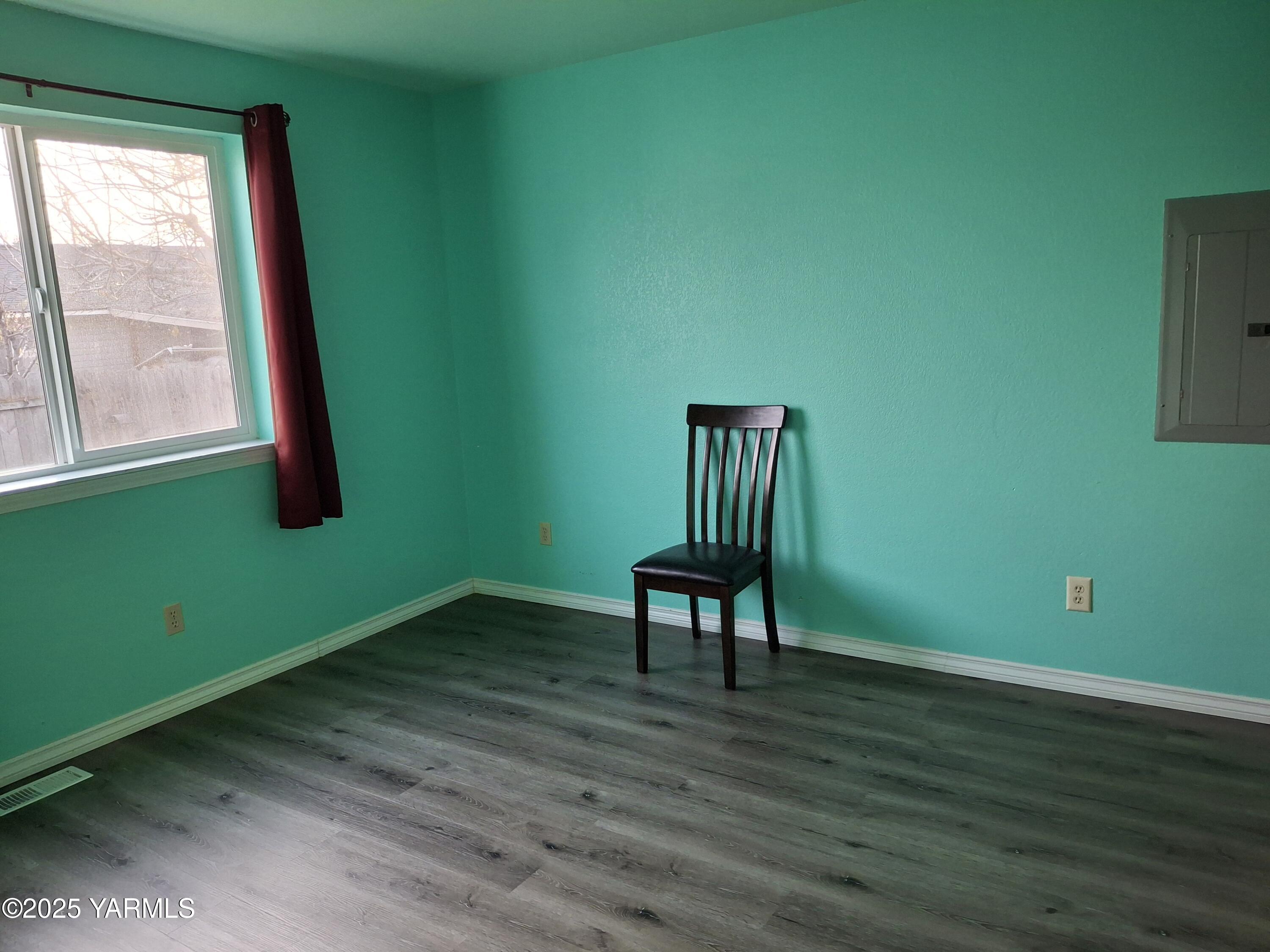866 Ismo Loop Sunnyside, WA 98944 - Photo 9 of 17 a view of a room with a wooden floor and a window