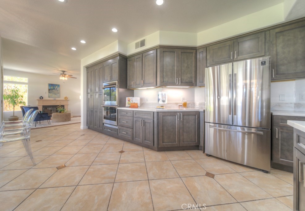 32230 Corte Chatada Temecula, CA 92592 - Photo 21 of 53 a kitchen with stainless steel appliances granite countertop a refrigerator and a sink