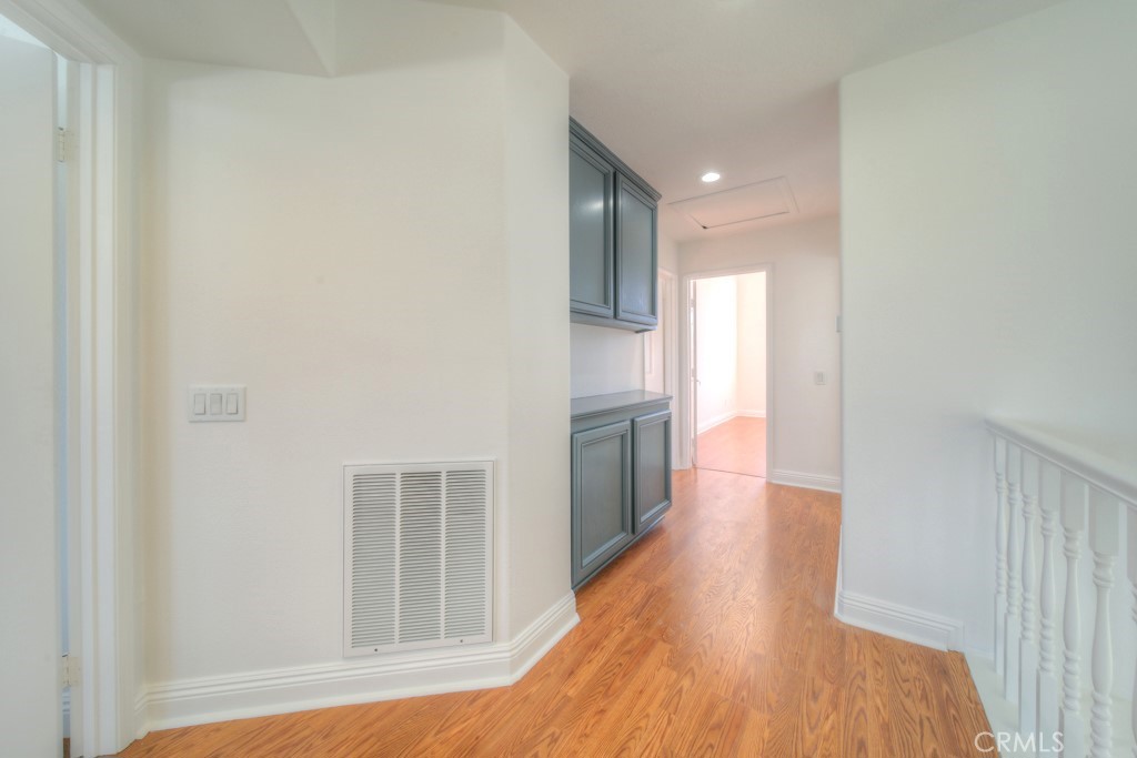32230 Corte Chatada Temecula, CA 92592 - Photo 28 of 53 a view of a hallway with wooden floor