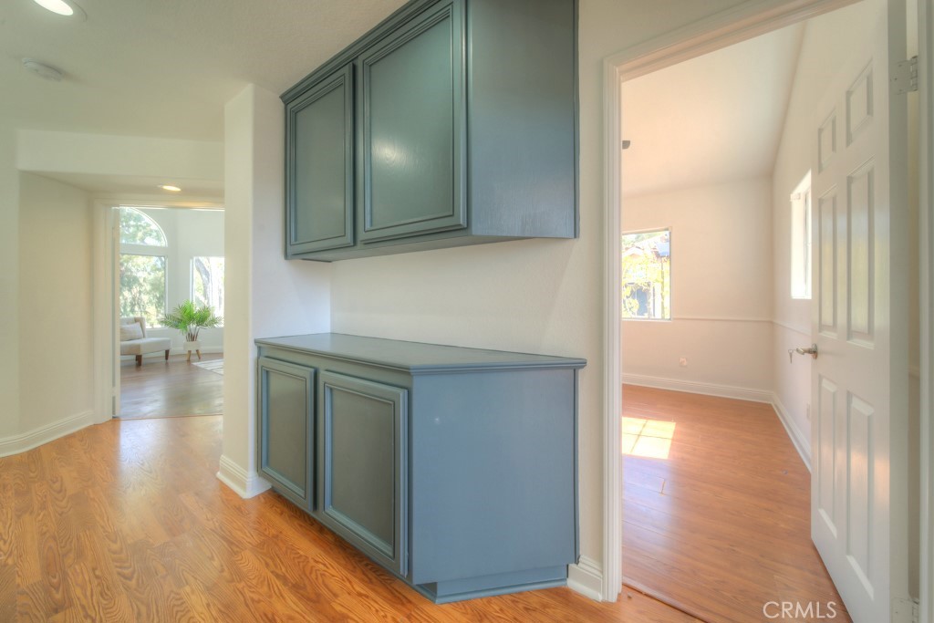 32230 Corte Chatada Temecula, CA 92592 - Photo 29 of 53 a view of a hallway to a livingroom with wooden floor and a bathroom