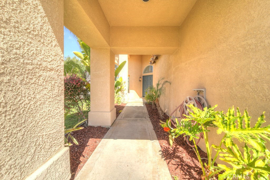 32230 Corte Chatada Temecula, CA 92592 - Photo 3 of 53 a view of a entryway with flower pots