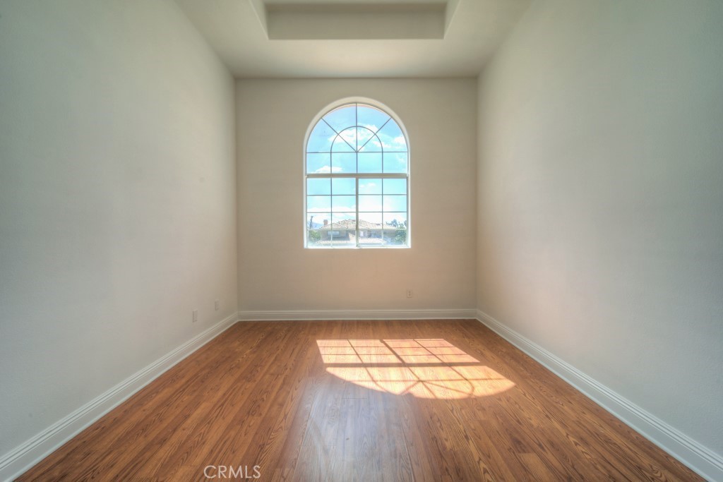 32230 Corte Chatada Temecula, CA 92592 - Photo 31 of 53 an empty room with wooden floor and windows