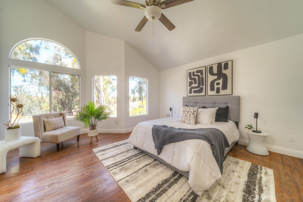 32230 Corte Chatada Temecula, CA 92592 - Photo 32 of 53 a bedroom with a bed couches and a large window