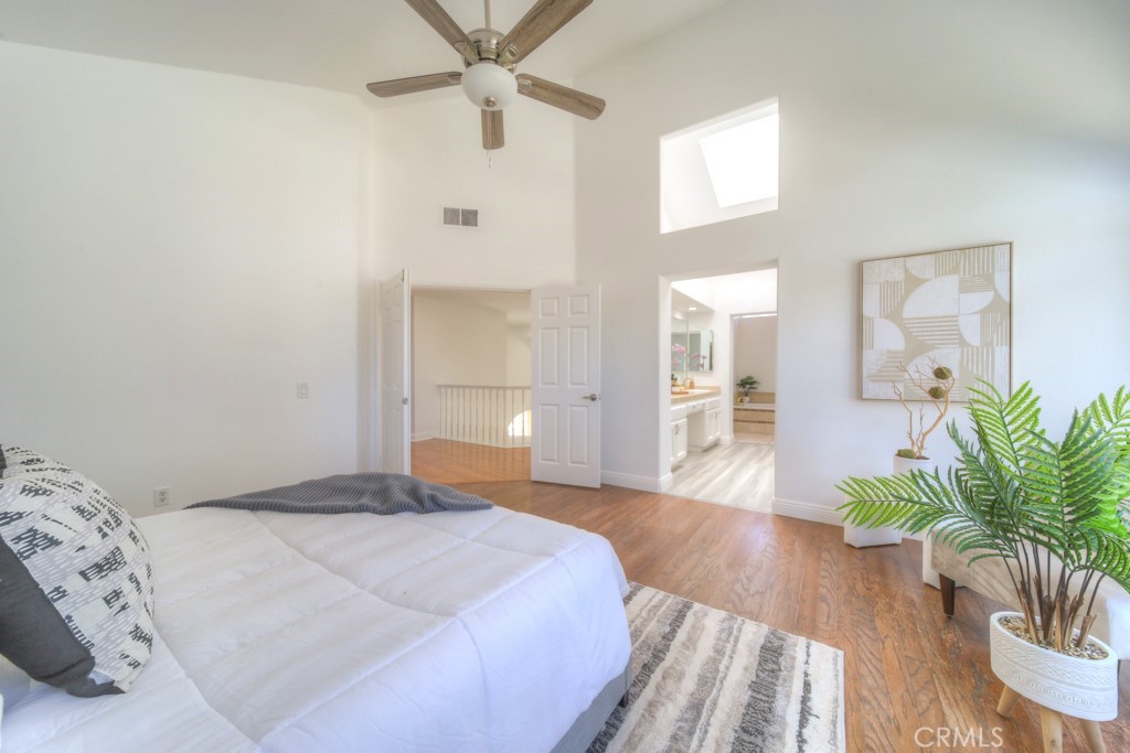 32230 Corte Chatada Temecula, CA 92592 - Photo 36 of 53 a bedroom with a bed and a potted plant