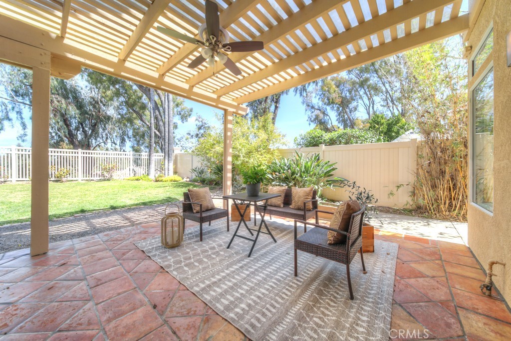 32230 Corte Chatada Temecula, CA 92592 - Photo 42 of 53 a view of a patio with table and chairs and floor to ceiling window