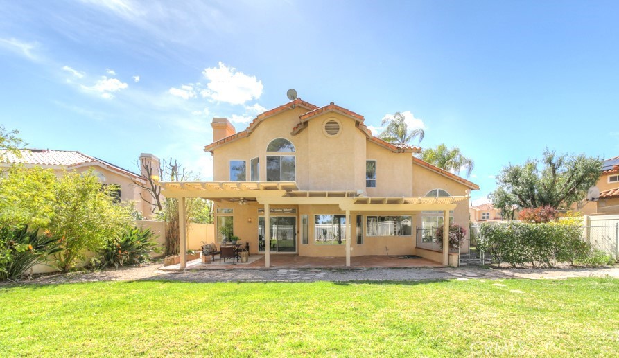 32230 Corte Chatada Temecula, CA 92592 - Photo 45 of 53 a front view of a house with a yard table and chairs