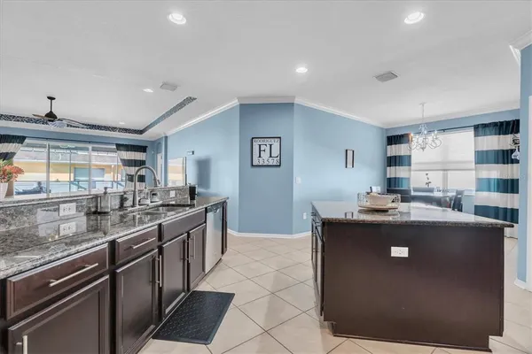 a kitchen with stainless steel appliances granite countertop a stove and a sink