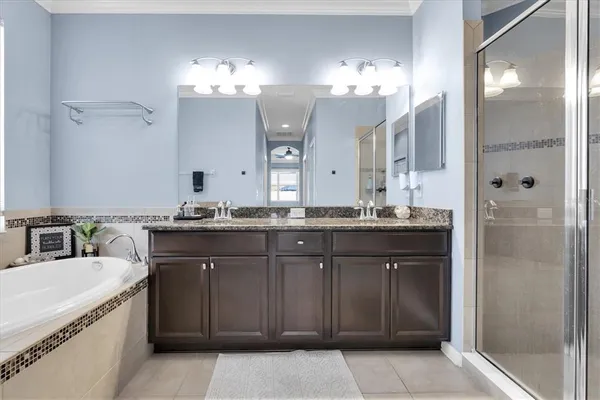 a bathroom with a sink vanity and a mirror