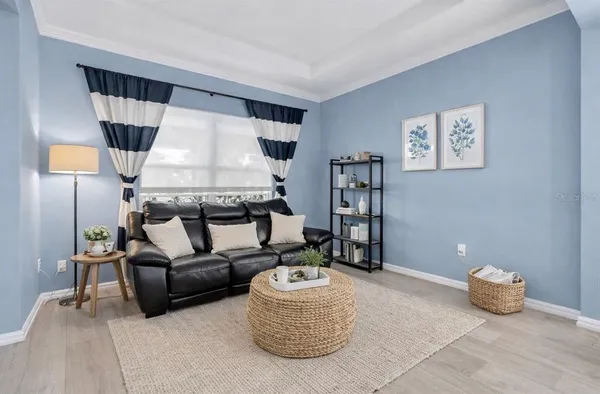 a living room with furniture and a window