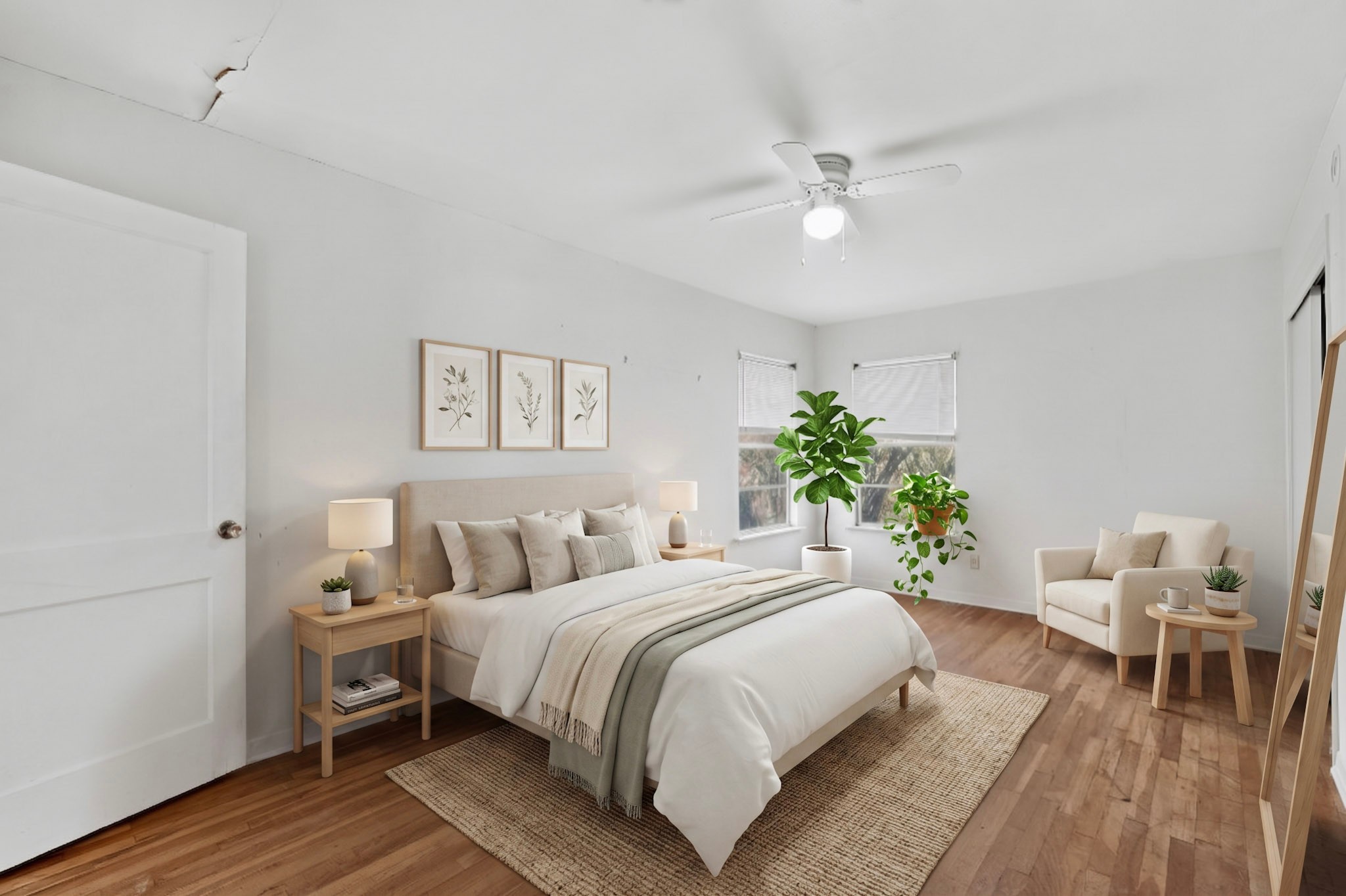 4703 Leslie Avenue Austin, TX 78721 - Photo 22 of 34 Sun-filled bedroom featuring rich wood flooring and a refreshing ceiling fan.