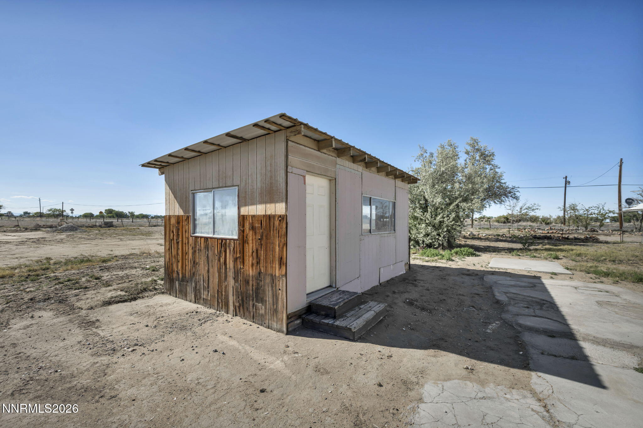 5250 Stillwater Road Fallon, NV 89406 - Photo 30 of 53 a front view of a house with a yard