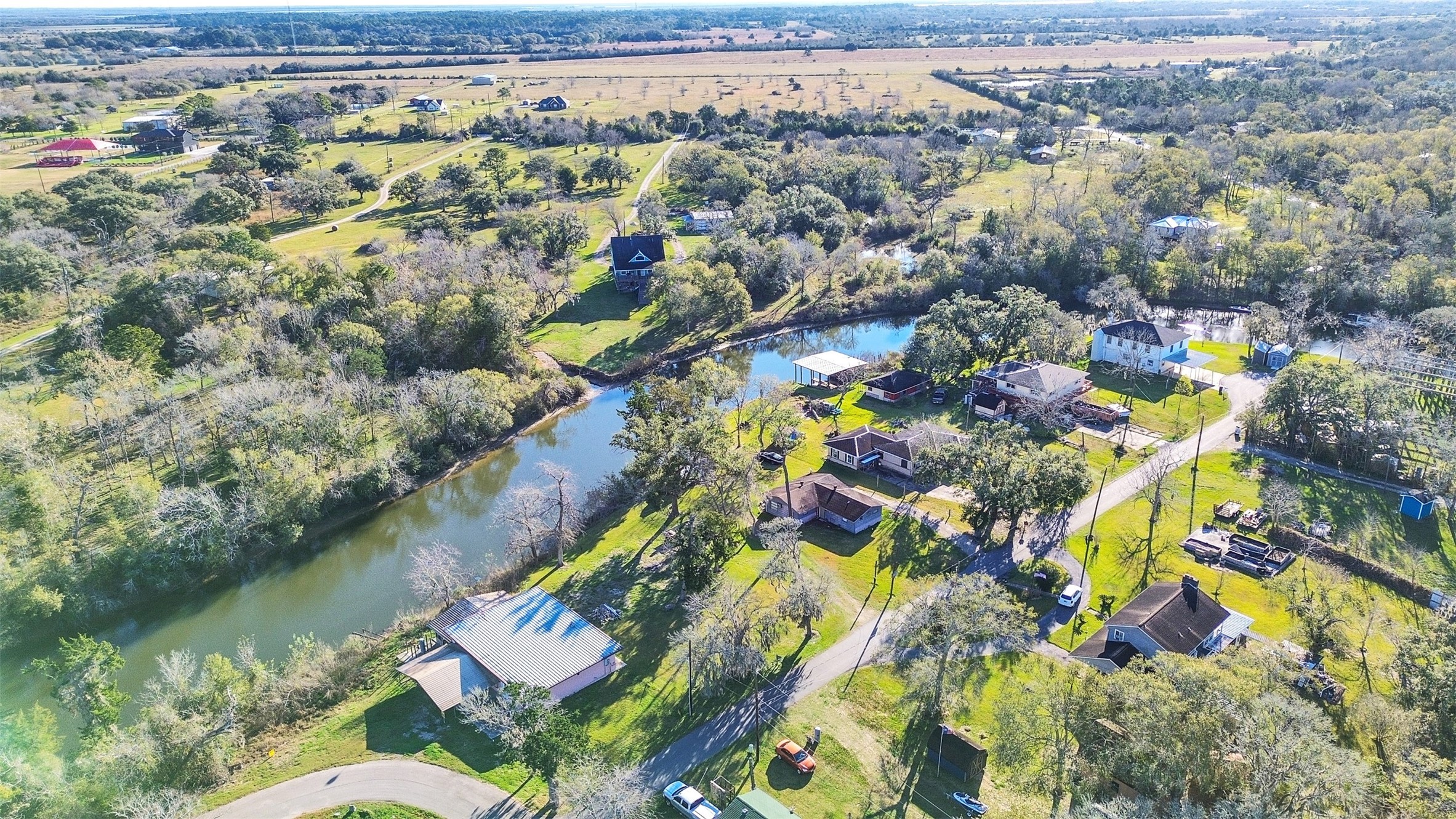 3307 St Anne Liverpool, TX 77577 - Photo 4 of 7 an aerial view of lake and residential houses with outdoor space