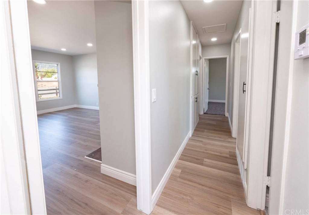 150 East Gladstone Street San Dimas, CA 91773 - Photo 17 of 37 a view of a hallway with wooden floor