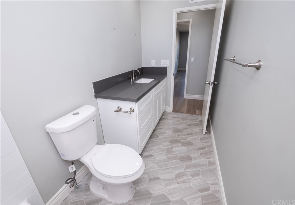 150 East Gladstone Street San Dimas, CA 91773 - Photo 20 of 37 a bathroom with a sink and a toilet