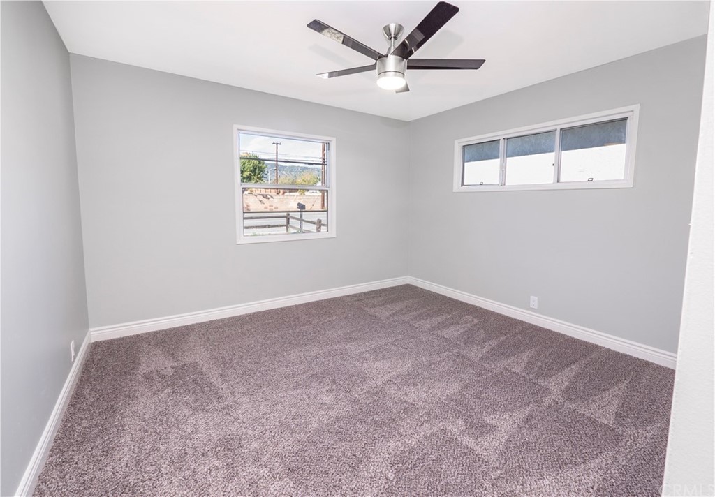 150 East Gladstone Street San Dimas, CA 91773 - Photo 24 of 37 a view of an empty room with a window